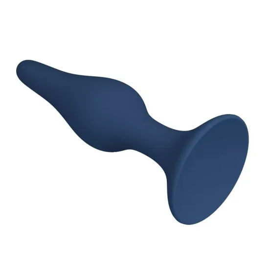 Plug anal de silicone azul Slim tamanho S posicionado deitado sobre uma superfície lisa